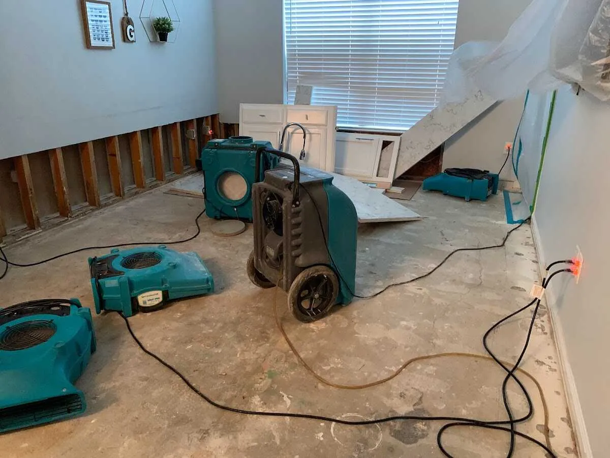 Dehumidifier in flood-cut room for Water Damage Restoration in Kochville